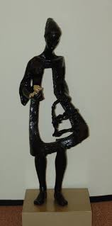 Statue of girl  greeting American      