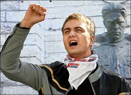 activist protests outside - via Daymix