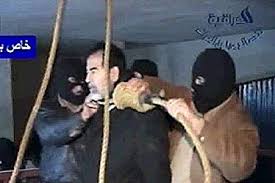   Saddam Hussein   look very calm and at    