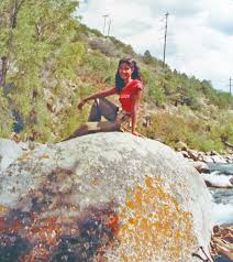 Nymphet on a rock,