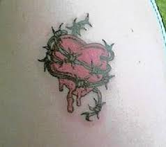 heart tattoo with barb wire - via Daymix
