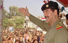 Iraqi President  Saddam   Hussein waves    