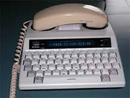   TTY   with phone handset on the  TTY      