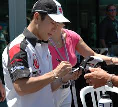 <b>Takuma</b>_<b>Sato</b>_signing.jpg