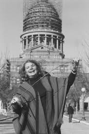   Molly Ivins   in front of the Texas    