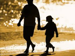 Dad And Son walking on the beach