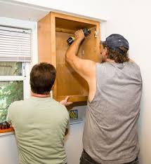 Installing kitchen cabinets is