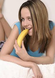     teen    masturbates with a banana            