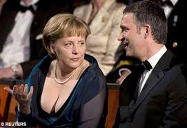 German Chancellor Angela Merkel shows off plunging neckline | Mail ...