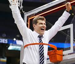 Geno Auriemma celebrates after - via Daymix