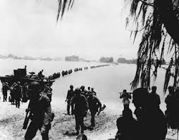 Marines wade ashore on  Saipan   