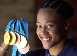 Image <b>Jones</b> hands back medals Picture