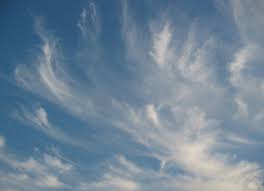 wispy clouds in a blue sky
