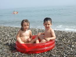 At the nudist beach