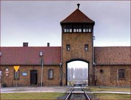 The main gate at Auschwitz, - via Daymix