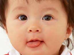 cute baby sticking tongue out