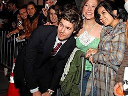 Image <b>Adam Brody</b> hunkers down with some <b>...</b> Picture