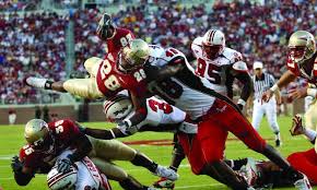  back Lorenzo Booker dives for 