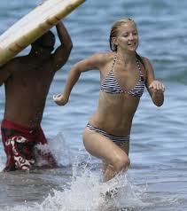     taking surfing lessons in  Maui  