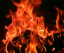 A fireplace fire warms ones face