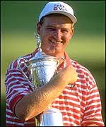 Ernie Els cradles the US Open trophy 