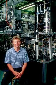  pictured with an atomic clock.