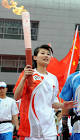 Photo: Torchbearer Li Na runs with the torch in Hefei - The ...