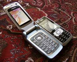Nokia 6120 Classic next to Nokia