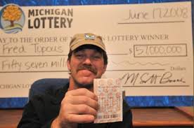 Fred Topous shows the Mega Millions 