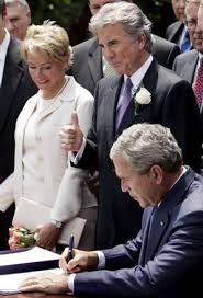 George W Bush signs the Adam Walsh 