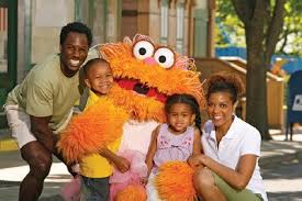 Happy family visiting Sesame Place.