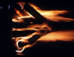 Wood fire in dark with dark