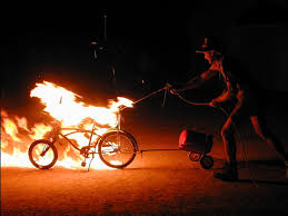 Man burning Schwinn bicycle