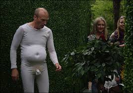 A man dressed in a nude suit