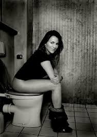 on a toilet. The lady in